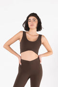 Woman wearing LESS Activewear Flow Sports Bra, designed for fuller busts