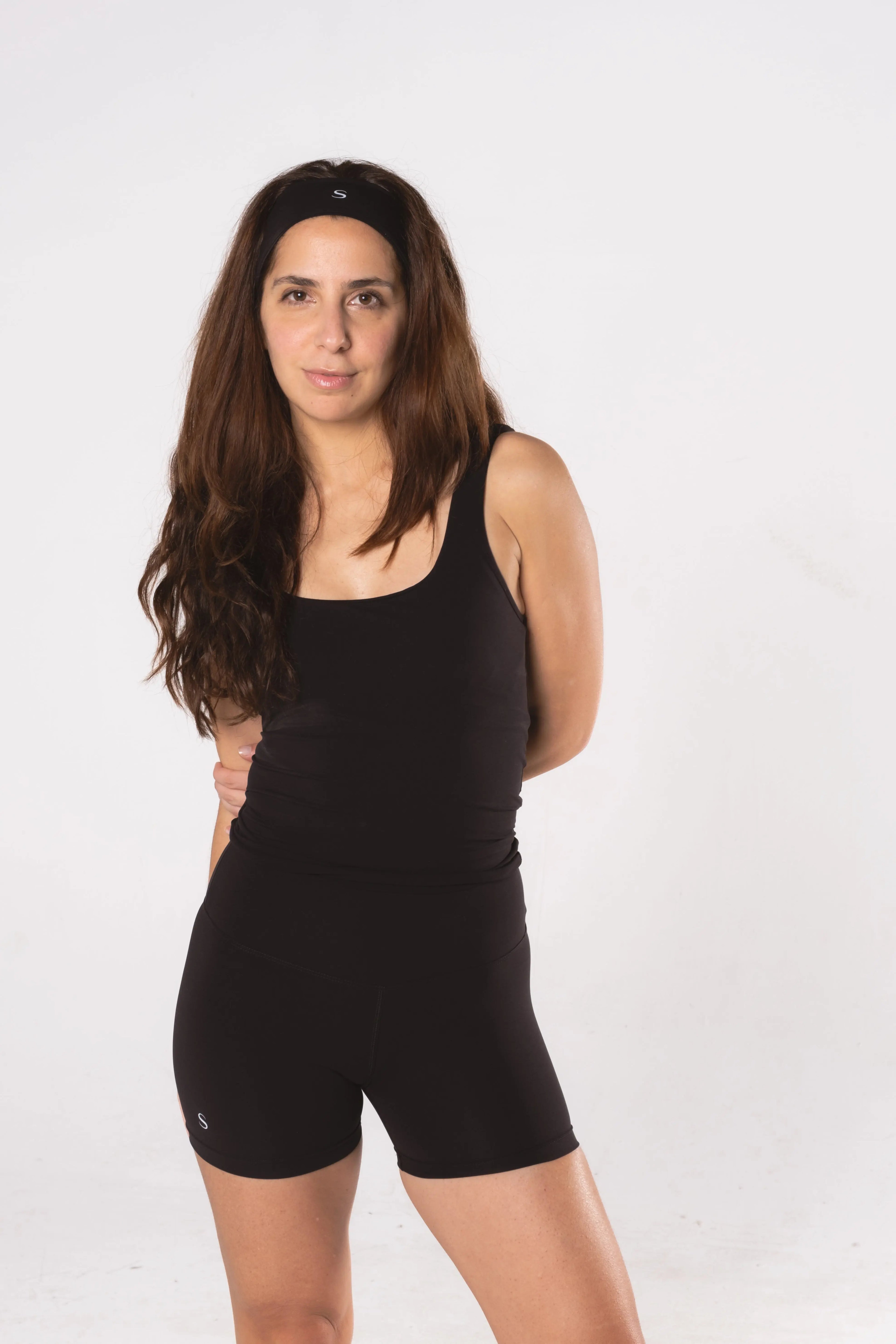 Woman wearing LESS Activewear Move Shorts, second skin fabric no waistband design