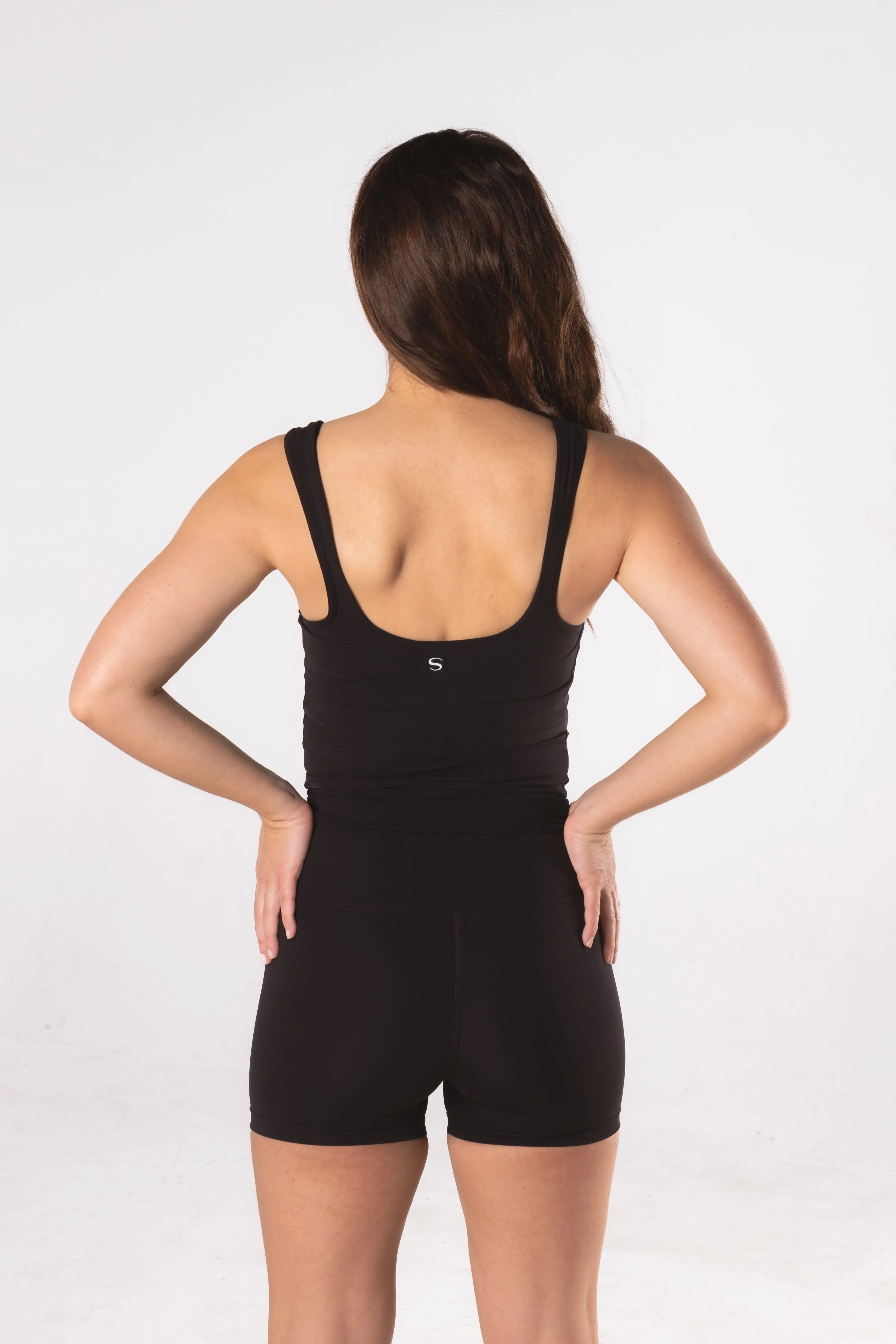 Woman wearing LESS Activewear Move Shorts, second skin fabric no waistband design