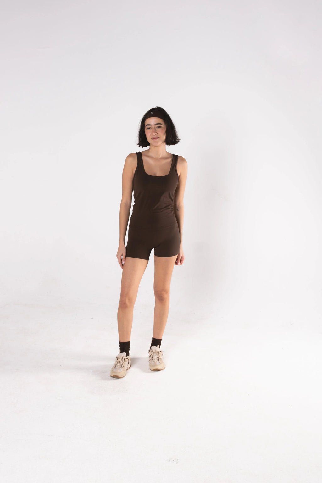 Woman wearing LESS Activewear Move Shorts, second skin fabric no waistband design