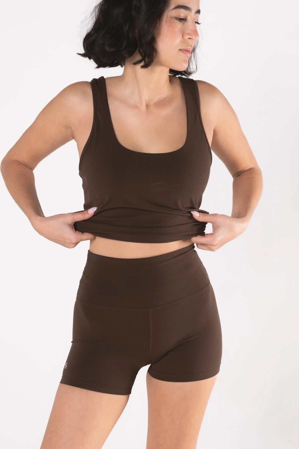 Woman wearing LESS Activewear Move Shorts, second skin fabric no waistband design