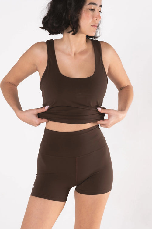 Woman wearing LESS Activewear Move Shorts, second skin fabric no waistband design