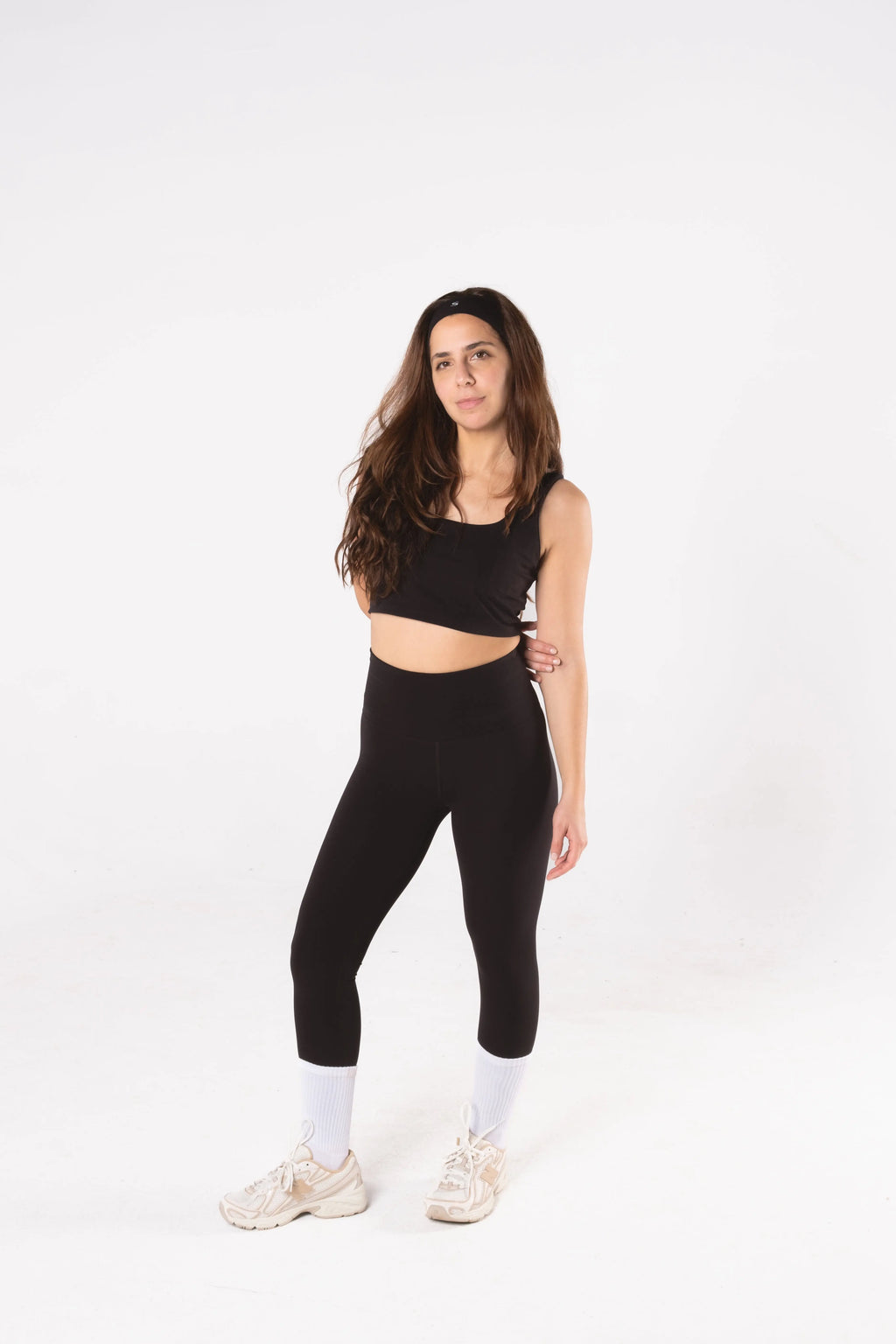 Woman wearing LESS Activewear Form Sculpting Leggings, second skin feel high waist design