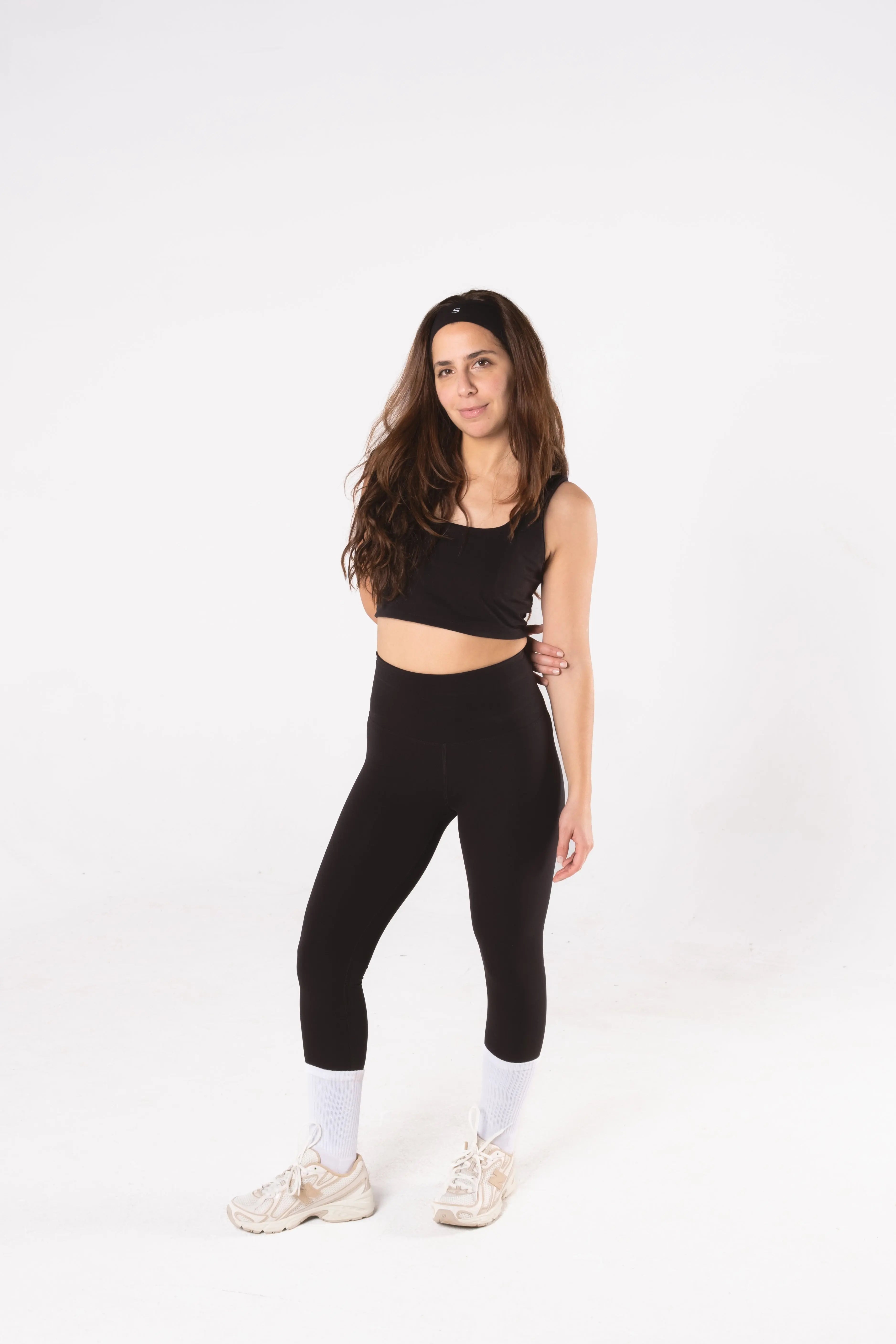 Woman wearing LESS Activewear Form Sculpting Leggings, second skin feel high waist design