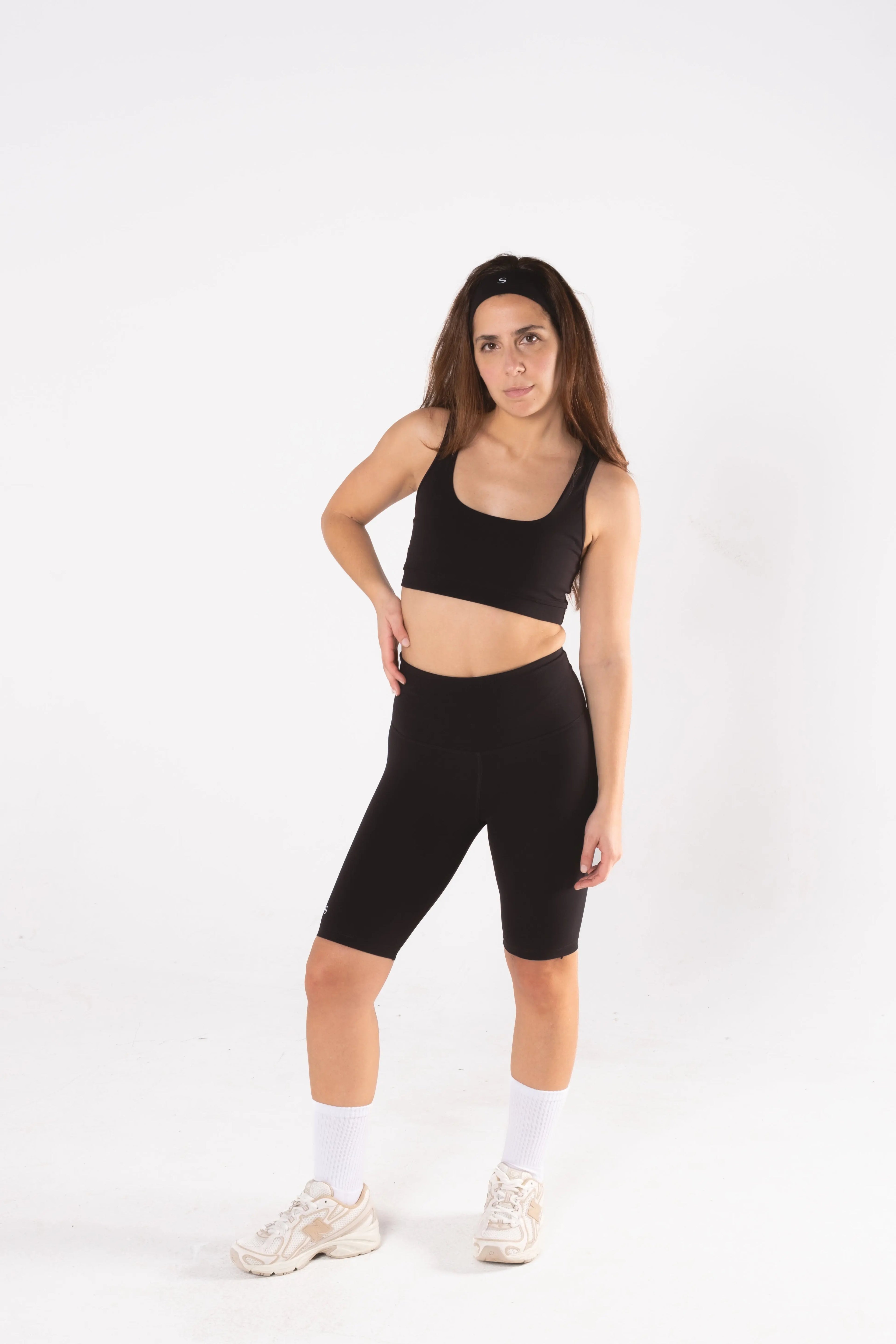 Woman wearing LESS Activewear Pace Cycling Shorts, second skin feel minimalist design