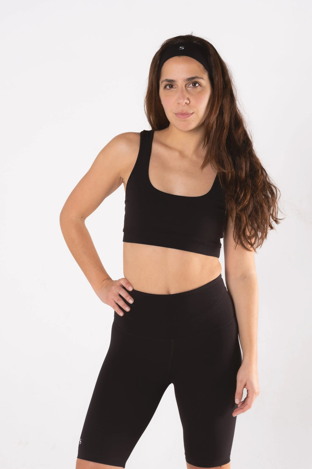 Woman wearing LESS Activewear Pace Cycling Shorts, second skin feel minimalist design