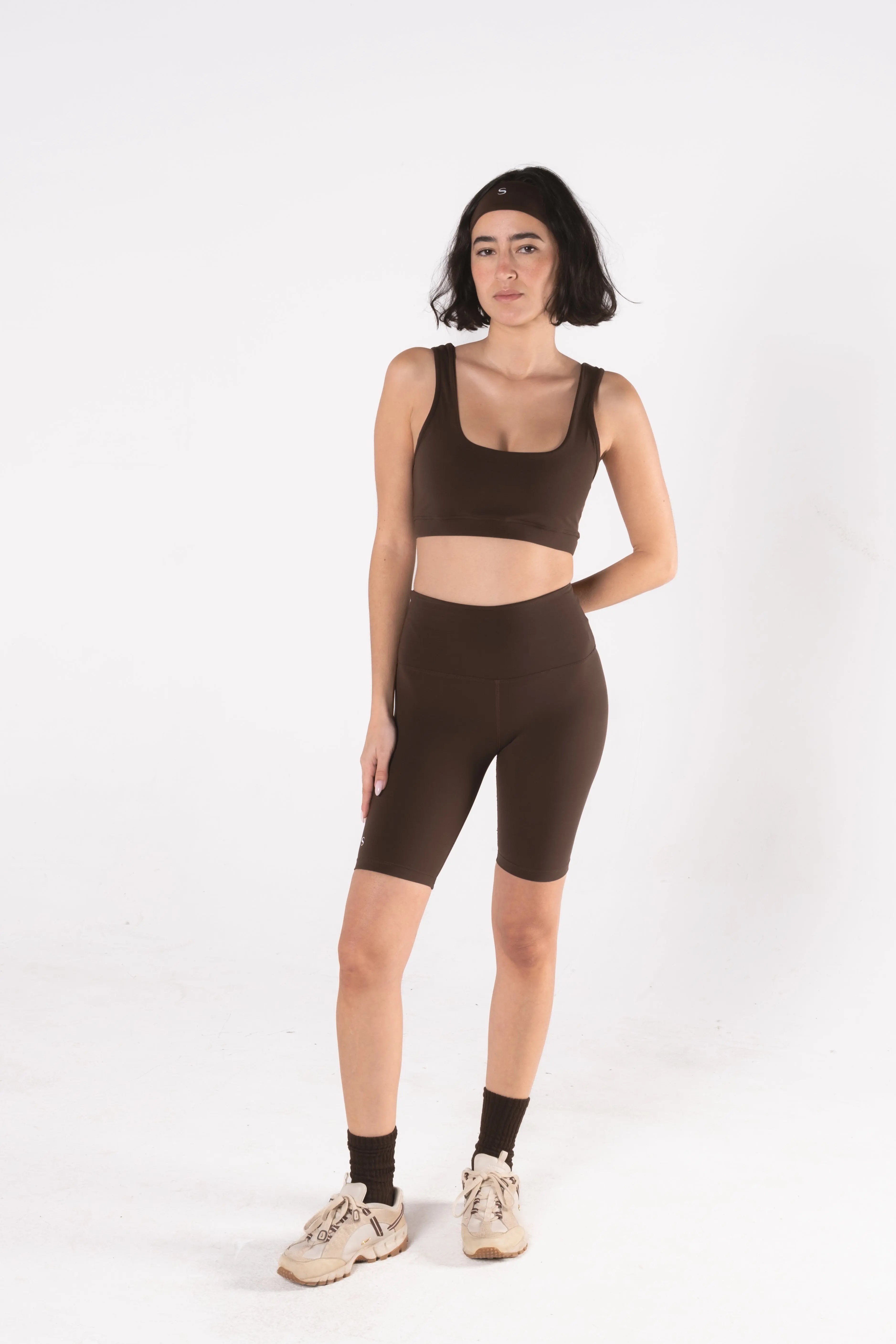 Woman wearing LESS Activewear Pace Cycling Shorts, second skin feel minimalist design