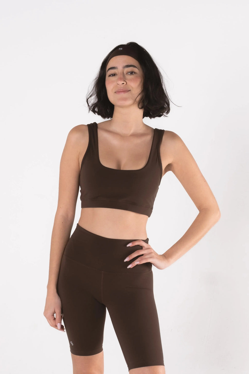 Woman wearing LESS Activewear Pace Cycling Shorts, second skin feel minimalist design