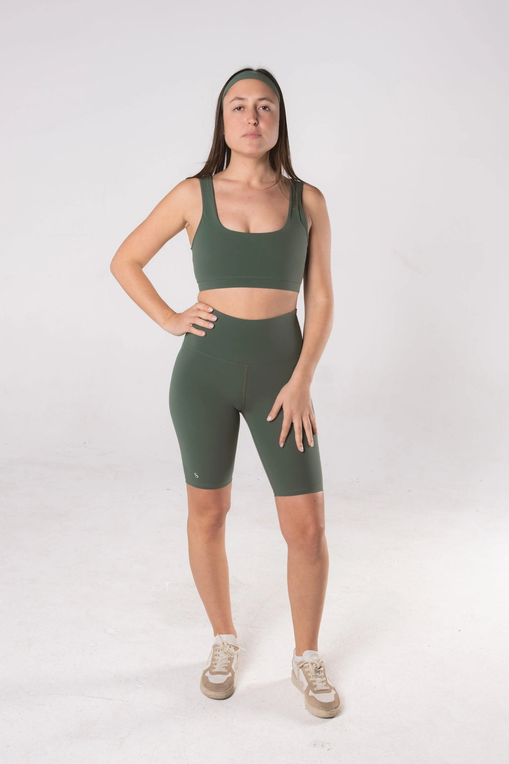 Woman wearing LESS Activewear Pace Cycling Shorts, second skin feel minimalist design