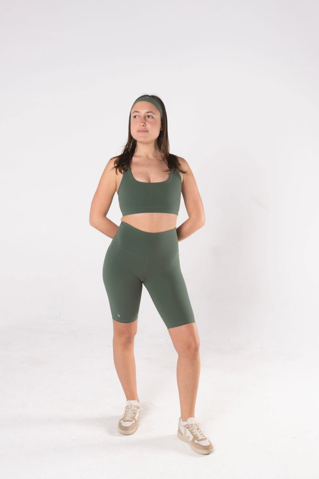 Woman wearing LESS Activewear Pace Cycling Shorts, second skin feel minimalist design